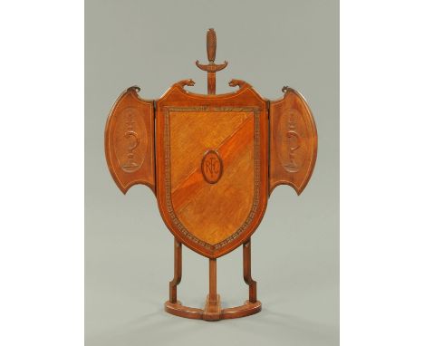 An early 20th century oak fire screen, bearing initials "RFC" for Royal Flying Corp, with angled wings to either side and rai
