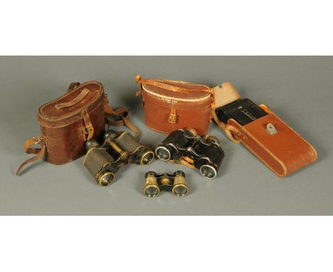 Two pairs of binoculars, opera glasses and a folding camera.  CONDITION REPORT: The large pair of binoculars are as they look