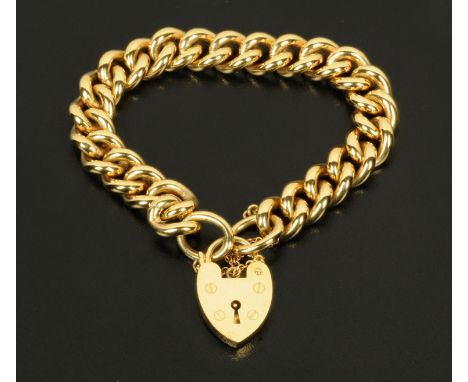 A 9 ct gold curb bracelet, with padlock and safety chain, 62.6 grams, Birmingham hallmark, maker C.L.J.  Length 187.4 mm, wid