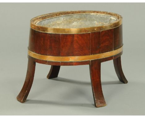 A Victorian mahogany brass bound planter, with galvanised liner and raised on splayed legs.  Width 62 cm. 