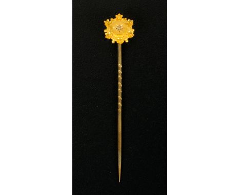 A diamond set stick pin, cased.