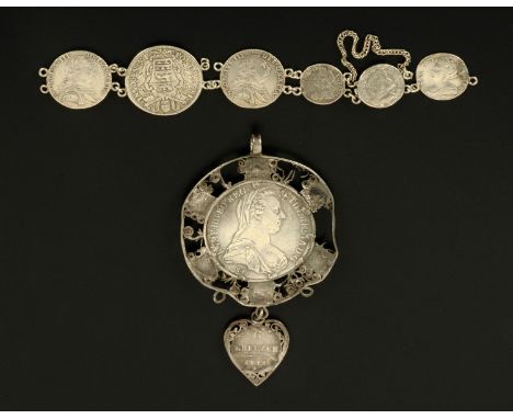 An Austrian coin pendant, Maria Theresia, with surround set with cut red stones, and a coin bracelet, the large coin dated 16