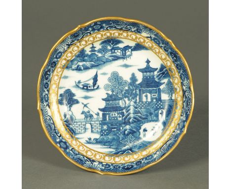 A Caughley blue and white circular bowl, with gilding, with Caughley S mark to base.  Diameter 20 cm.  CONDITION REPORT: Gene
