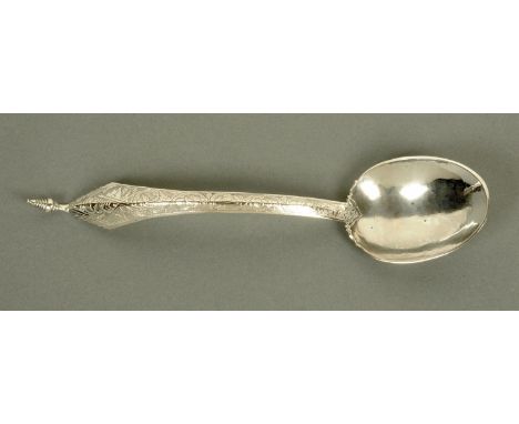 A Malayan silver ladle, foliate and flag engraved, hallmarks to rear.  Length 27 cm. 