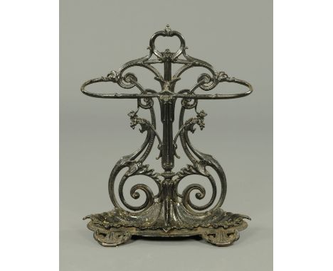 A Victorian cast iron stick stand, with two apertures and shaped drip tray.  Height 77 cm (see illustration). 