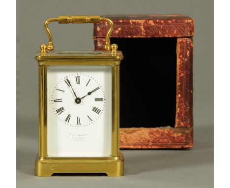 An early 20th century brass carriage clock, by R. & L. Christie, Edinburgh, with French movement, cased.  Height excluding ha