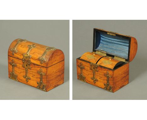 A Victorian walnut domed topped tea caddy, marked "Valentine, Dundee" and with containers for both black and green tea.  Widt