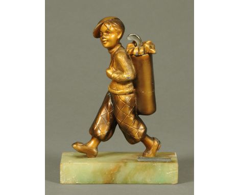 An Art Deco spelter figural cigarette lighter, young boy with caddy and clubs, raised on a marble base.  Height 21 cm. 