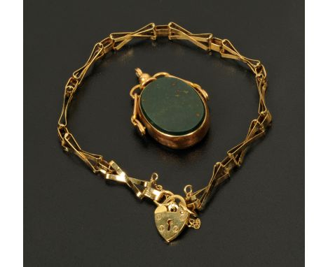A 9 ct gold bloodstone and green agate swivel fob, and a 9 ct gold bracelet with padlock and safety chain, chain weight 3.6 g