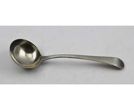 A GEORGE III SILVER SAUCE LADLE having bright cut decoration to the edge of the handle, London 1785, makers mark indistinct, 