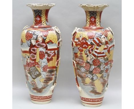 A PAIR OF JAPANESE SATSUMA POTTERY VASES, of baluster form with ring and cord type handles, and gilded polychrome decoration,
