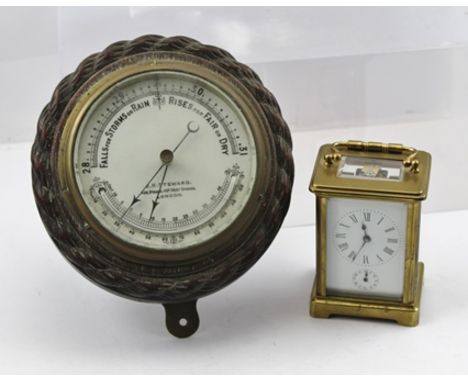 A LATE 19TH CENTURY FRENCH CARRIAGE CLOCK, the brass framed case with bevelled glass panels, the white enamel dial with Roman