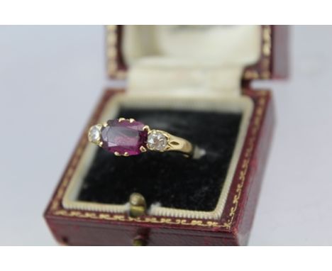 A LADY'S DRESS RING, diamond set about a cushion cut stone, band considered to be 18ct, in Jeweller's presentation box, size 