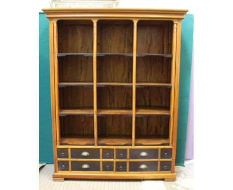 A CONTEMPORARY CHERRY WOOD VENEERED BOOKCASE of architectural 19th century style with partial columns dividing three sections