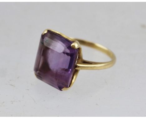 A CUSHION CUT AMETHYST DRESS RING, in a 14k setting and band, size H 1/2 