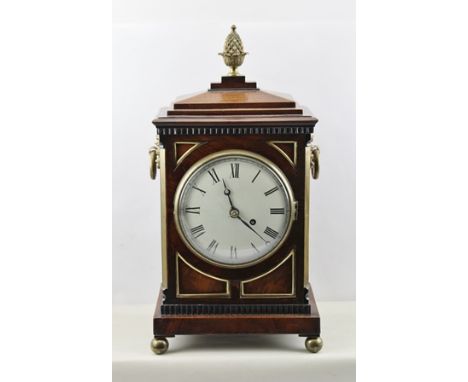 A LATE GEORGIAN/EARLY VICTORIAN REGENCY STYLE MAHOGANY BRACKET TIMEPIECE, having stepped pediment, later finial and flank bra
