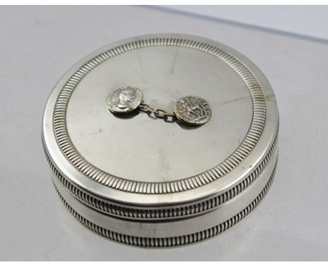 MARIA PERGAY (Nee en 1930) A SILVER PLATED CUFF LINK TIDY BOX, the cover mounted with a cuff link, classically decorated for 