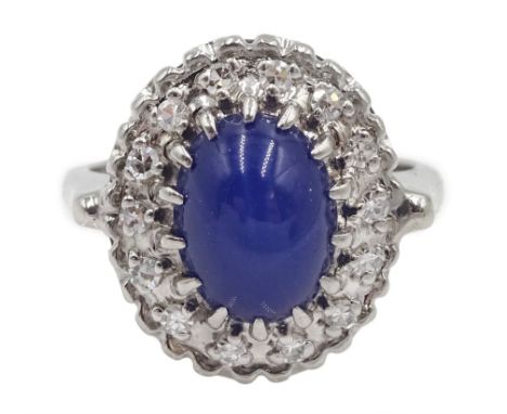 White gold star sapphire and diamond cluster ring, stamped 14K - Condition Report Approx 4.15gm, size I, overall head size = 