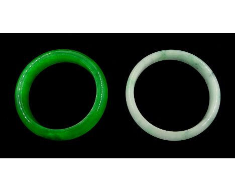 Apple green jade bangle and one other jade bangle - Condition Report Inner circumference = 17.8cm