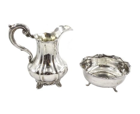 Victorian silver milk jug,  scroll handle and on foliate bracket feet by John &amp; Henry Lias, London 1844 and a silver suga