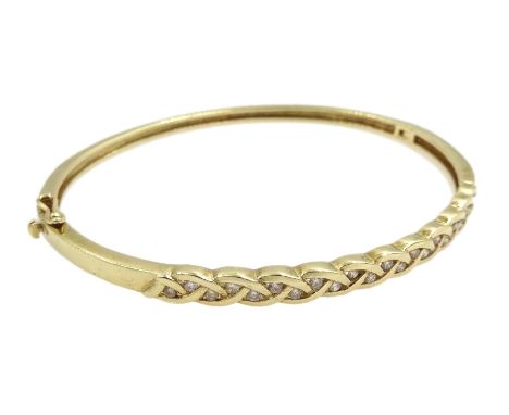 9ct gold diamond hinged bangle, twenty two round brilliant cut diamonds set in a weave design, stamped 375  - Condition Repor