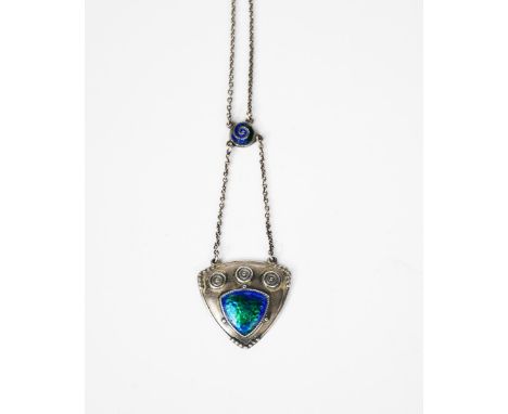 A Charles Horner silver and enamel pendant, shield shaped, cast in low relief and enamelled with a green and blue panel, stam