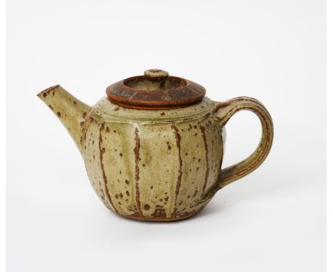 Richard Batterham (1936-2021) a small stoneware cut-sided teapot and cover, covered in an ash glaze unsigned, paper label num