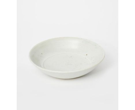Richard Batterham (1936-2021) a small porcelain bowl, covered in a pale celadon glaze unsigned 15.5cm. diam. Provenance From 