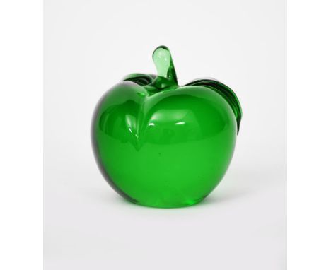 A glass Apple paperweight designed by John Lyndon for The Apple Boutique, 1968, green glass, cased in clear, unsigned 9cm. hi