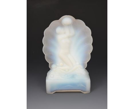 An Art Deco opalescent glass table lamp probably Sabino or Etling,  modelled as a naked maiden offering up a pearl, before a 