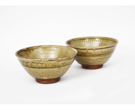 Richard Batterham (1936-2021) two footed stoneware bowls, both with chattering bands to the interior, covered to the foot wit