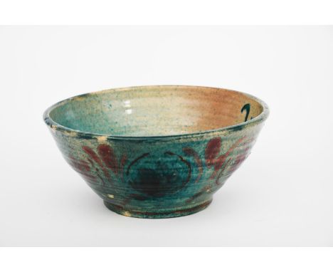 Quentin Bell (1910-1996) a Fulham Pottery bowl, flaring form on shallow foot, painted with floral design in red on a turquois