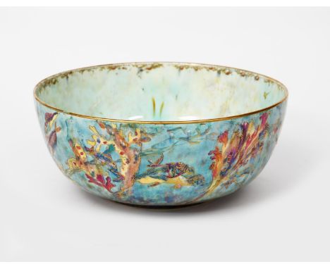 A Wedgwood Pottery lustre bowl designed by Daisy Makeig-Jones, the exterior printed and painted with fish swimming amidst wat