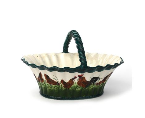 A large Wemyss Pottery egg basket retailed by Thomas Goode,  flaring fluted form with rope-twist over-slung handle, painted w