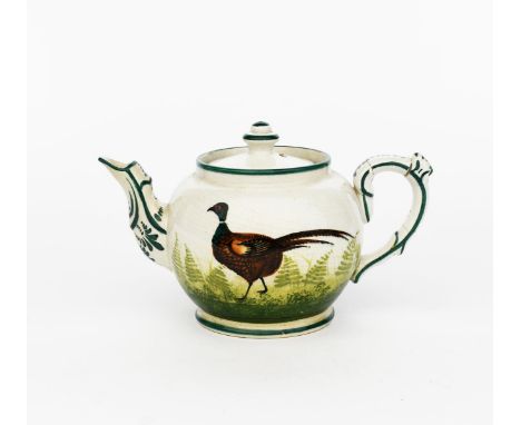 A Wemyss Pottery Pheasant teapot and cover, ovoid, painted with a bird walking before ferns, in colours impressed factory mar