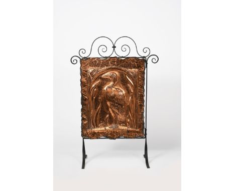 A copper and patinated metal fire screen, the rectangular copper panel stamped in low relief with a wading bird amongst bull 