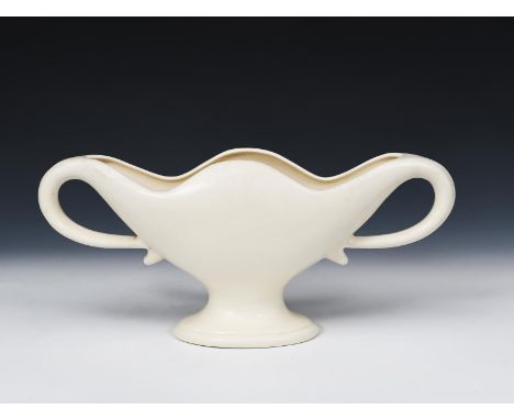 A The Fulham Pottery twin-handled vase designed by Constance Spry,  footed form, with flaring bowl, covered in a matt cream g