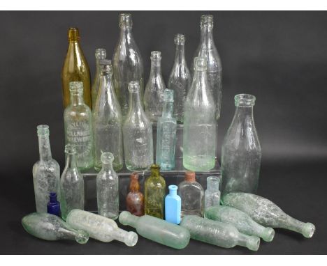 A Collection of Various Vintage Glass Bottles to Include Beer Bottles etc 