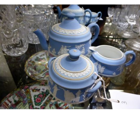 A Wedgwood pale blue jasper ware three piece tea service,  c.1900, impressed 'Wedgwood' and 'England', comprising teapot, cov