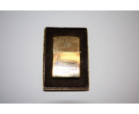 A vintage Zippo 'USS John F. Kennedy CV-67' lighter inscribed to the Commanding Officer, Jerry O Tuttle, boxed,  