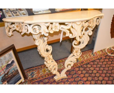 A carved cream and gilt console table a/f. 