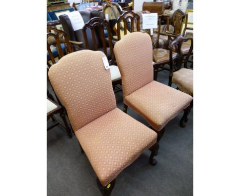 A pair of upholstered side chairs with shells to cabriole knees (2).  