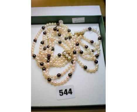 Three strand cultured black & white pearl necklace with 14ct gold clasp, plus matching bracelet (2).  