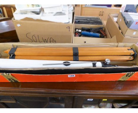 A boxed Japanese telescope with tripod,  