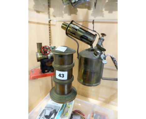 Three brass collectibles comprising a money box, Primus 63 blowlamp and a Mamod steam engine. 