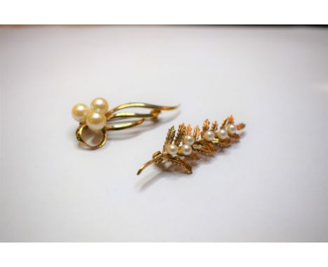 Two pearl-set brooches, one 14ct; one 9ct gold. 