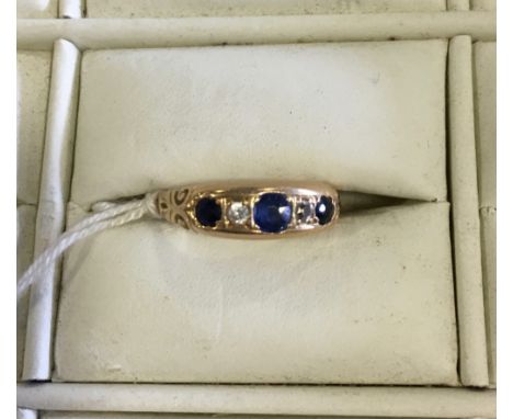 Yellow metal ring 3 sapphires and 2 diamonds size R/S