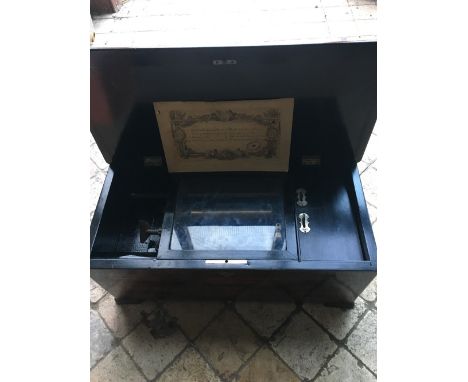 Good 19th century music box in rosewood case, playing 8 airs with original card.