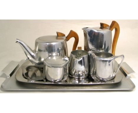 A Picquot Ware three piece tea service on unrelated tray and a Canadian tray decorated with a stag. CONDITION REPORT No visib