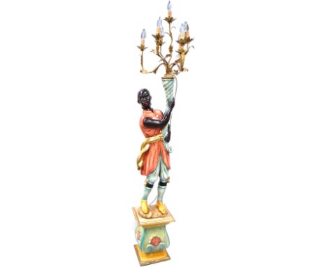 A modern Blackamoor lamp supporting a six branch gilded candelabrum, height approx 78cm.